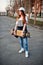 Young teenage urban girl with skateboard