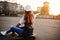 Young teenage urban girl with skateboard