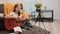 Young teenager girl practicing guitar