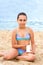 Young teenager girl summer sea beach sunblock sunscreen cream