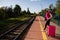 A young teenager from high society, she leaves the provinces on her first vacation trip and waits on the train platform