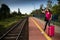 A young teenager from high society, she leaves the provinces on her first vacation trip and waits on the train platform