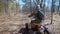 A young teenager is riding a four-wheeled quad ATV on a country road, a guy wearing a protective helmet on his head