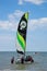 Young teenagers take sailing lessons on small Catamarans