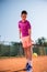 Young tennis player prepares for serving the ball. High concentration,