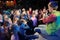 Young theatergoers. children enthusiastically watching children\'s Christmas puppet show theatre Smeshariki.