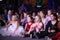 Young theatergoers. children enthusiastically watching children\'s Christmas puppet show theatre Smeshariki.