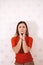 young thin girl in a knitted suit on a light background. Tenderness, femininity.