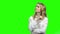 Young thoughtful woman on chroma key background.