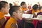 Young Tibetan monks reading religious scriptures