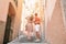 Young tourist couple traveling on european holidays outdoors in italian vacation in Cinque Terre