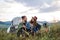 Young tourist couple travellers with tent shelter sitting in nature, resting.