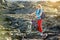 Young tourist cycling on lava field on Hawaii. Female hiker heading to lava viewing area at Kalapana on her bike. Tourist on hike