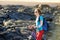 Young tourist cycling on lava field on Hawaii. Female hiker heading to lava viewing area at Kalapana town on her bike.