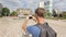 Young tourist filming 360 degree panorama using application for smartphone