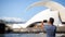 Young tourist male looking at the view and taking photos of landmarks in Tenerife, Spain