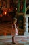 A young tourist in the small church of the monastery of the Virgin Mary in Paleokastritsa
