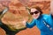 Young tourist taking a photo of herself by famous Horseshoe Bend, Arizona