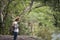 Young tourist woman with backpack feel lonely while standing on top