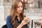 Young tourist woman eating authentic pizza outdoors.