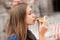 Young tourist woman eating authentic pizza outdoors.