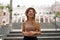 Young tourist woman in front of the historic Cruz e Sousa palace in the center of Florianopolis, Santa Catarina, Brazil