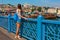 Young tourist woman on Galata bridge, Golden Horn bay, Istanbul. Panorama cityscape of famous tourist destination Bosphorus strait