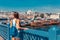 Young tourist woman on Galata bridge, Golden Horn bay, Istanbul. Panorama cityscape of famous tourist destination Bosphorus strait