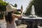 Young tourist woman taking a photo with her mobile phone at the Koutoubia mosque in the city of Marrakech in Morocco