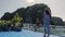 Young Tourists A Man and A Woman Are Sailing On a Ferry on a River Among Mountains and Jungles in Asia