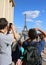 Young tourists photograph the Eiffel Tower