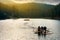 Young tourists on a raft in the middle of a lake