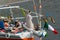 Young tourists sleeping on the deck of a felucca while the Arab pilot steers it