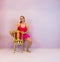 Young transgender ballet dancing girl posing on a chair, LGBT portrait in the sport