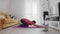 Young transgender homosexual man with make up doing static plank and then doing stretching on mat with help of his