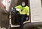 Young transporter on the truck with face mask and protective gloves for Coronavirus