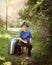 Young Travel Boy with Suitcase on Nature Trail