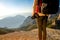 Young traveler photographer on the mountain