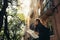 Young traveler woman admiring beautiful sunny narrow streets in Lisbon, Portugal