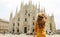 Young traveler woman visiting Milan Cathedral in Italy. Fashion female tourist standing on Piazza Duomo square in Milan