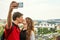 Young travelers couple in love walking on a street of European city. sightseeing traveler taking selfie photo. Prague