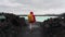 Young traveling man standing and looking blue lagoon in Iceland.