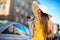 Young traveling woman with photo camera and panama, dressed in y