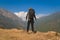 Young traveller trekking on forest trail , Nepal