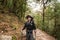 Young traveller trekking on forest trail , Nepal