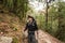 Young traveller trekking on forest trail , Nepal