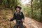 Young traveller trekking on forest trail , Nepal