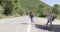 Young travellers hitch hiking on road