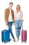 young travelling couple with suitcases looking at camera