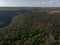 Young trees, plantations on the slopes. Top down Aerial view on the Dniester Canyon, River, Bakota Bay in National Park Podilski